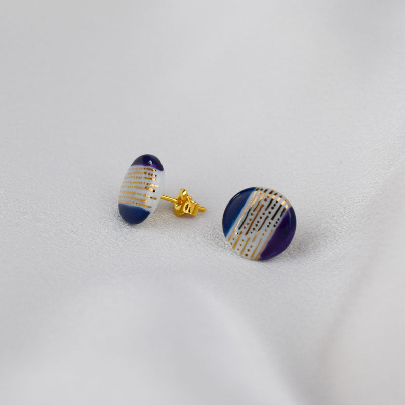Porcelain stud earrings created and hand-painted by Vali Bondoc with high temperature ceramic dyes and gold