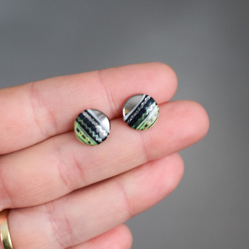 Porcelain stud earrings created and hand-painted by Vali Bondoc with high temperature ceramic dyes 