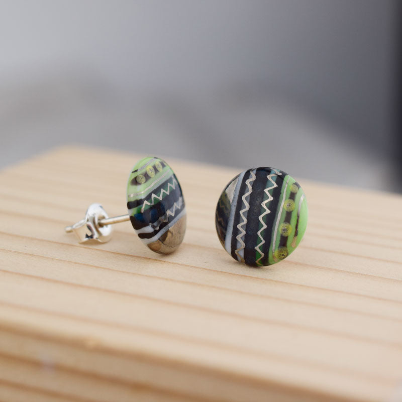 Porcelain stud earrings created and hand-painted by Vali Bondoc with high temperature ceramic dyes