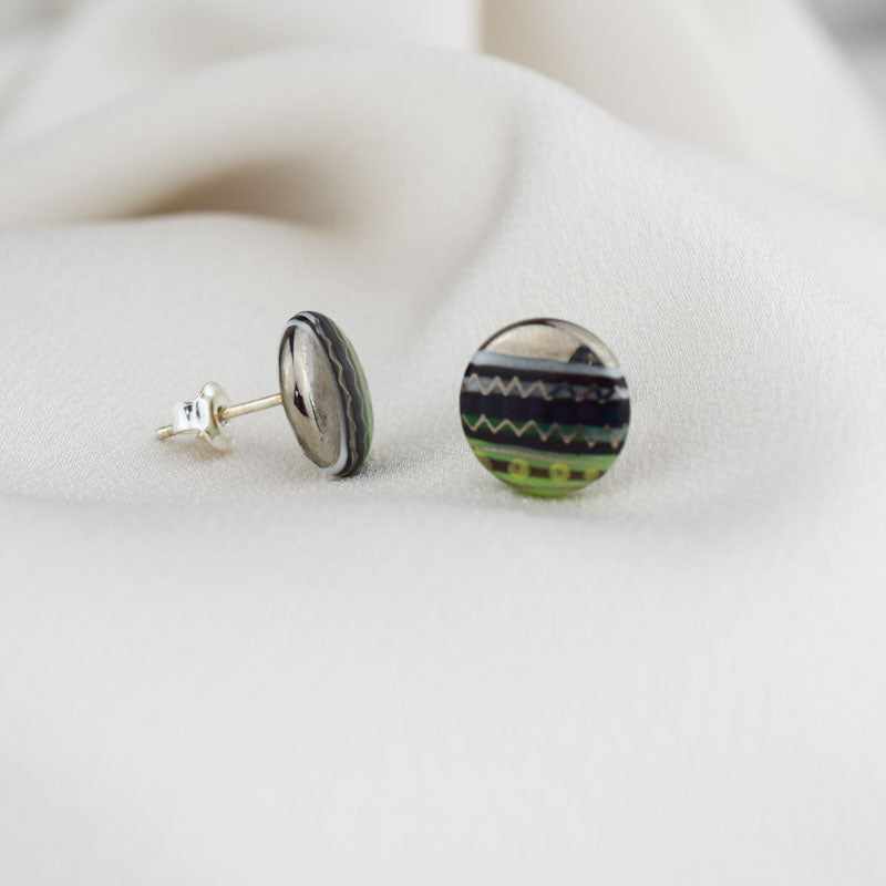 Porcelain stud earrings created and hand-painted by Vali Bondoc with high temperature ceramic dyes and gold