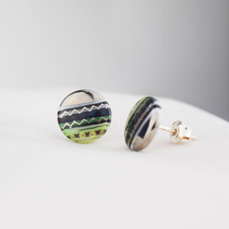 Porcelain stud earrings created and hand-painted by Vali Bondoc with high temperature ceramic dyes and platinum