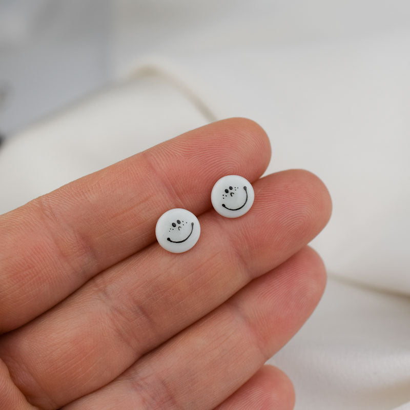 Porcelain stud earrings created and hand-painted by Vali Bondoc with high temperature ceramic dyes
