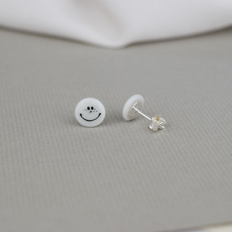 Porcelain stud earrings created and hand-painted by Vali Bondoc with high temperature ceramic dyes