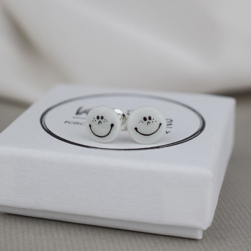 Porcelain stud earrings created and hand-painted by Vali Bondoc with high temperature ceramic dyes