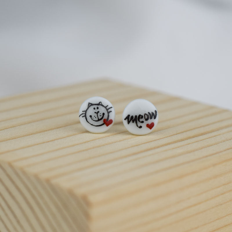 Porcelain stud earrings created and hand-painted by Vali Bondoc with high temperature ceramic dyes