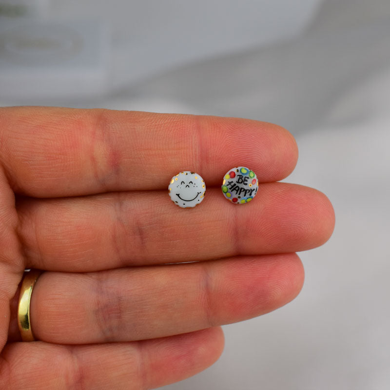 Porcelain stud earrings created and hand-painted by Vali Bondoc with high temperature ceramic dyes