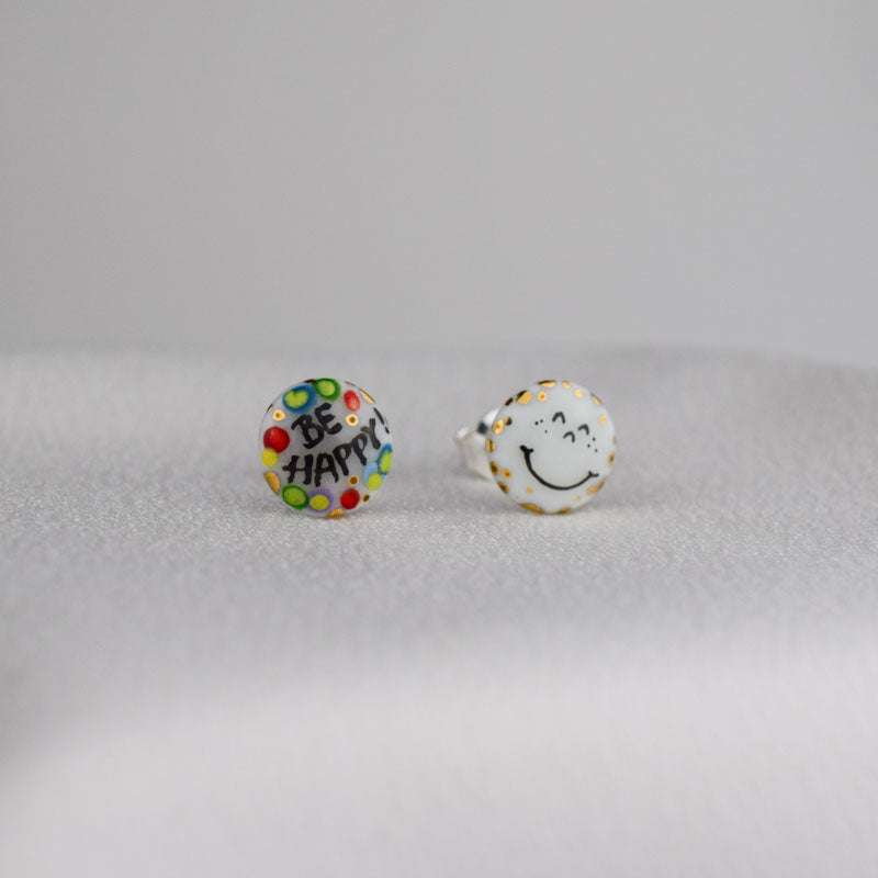 Porcelain stud earrings created and hand-painted by Vali Bondoc with high temperature ceramic dyes