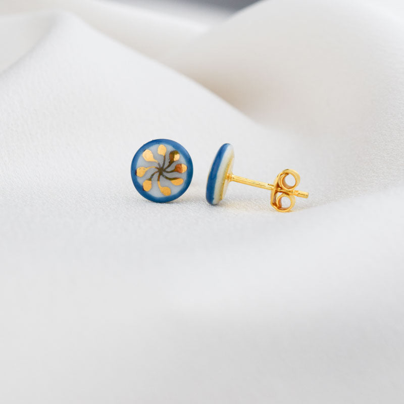 Porcelain stud earrings created and hand-painted by Vali Bondoc with high temperature ceramic dyes and colloidal gold