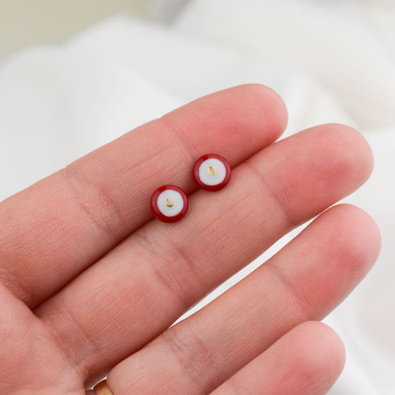 Porcelain stud earrings created and hand-painted by Vali Bondoc with high temperature ceramic dyes and gold