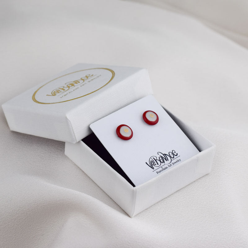 Porcelain stud earrings created and hand-painted by Vali Bondoc with high temperature ceramic dyes and gold