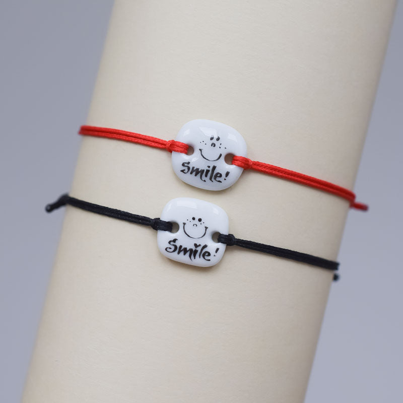 Smile. Porcelain bracelet handmade and hand painted by Vali Bondoc