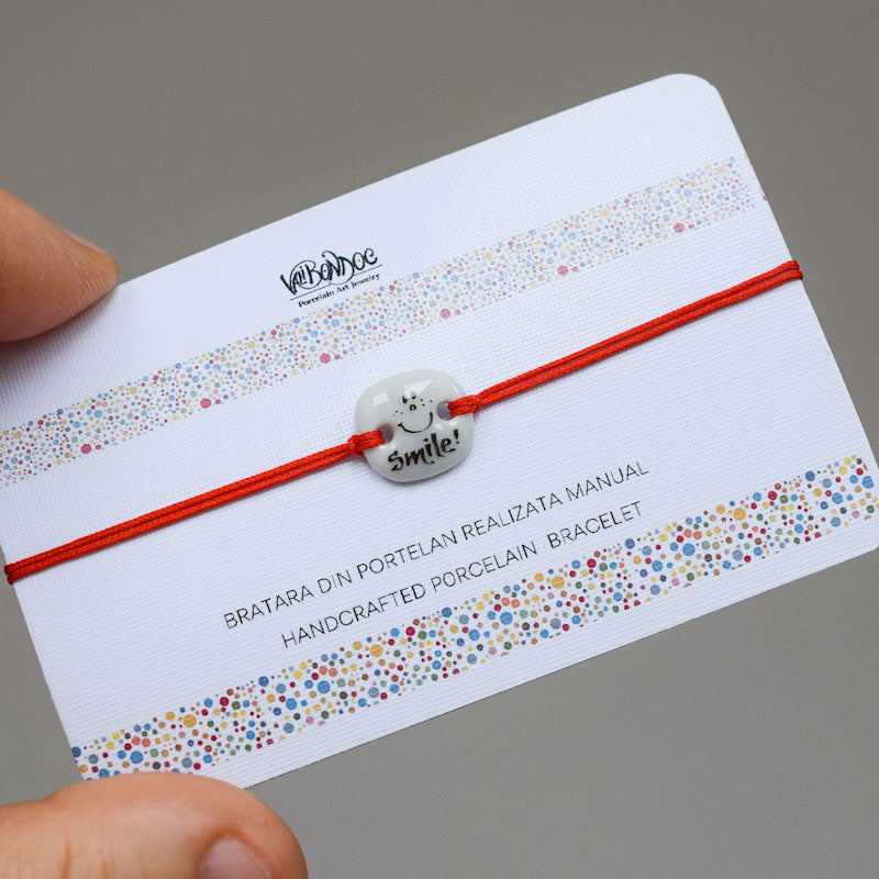 Smile. Porcelain bracelet handmade and hand painted by Vali Bondoc