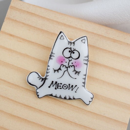 Topy cat. Porcelain brooch created and hand-painted by Vali Bondoc with high temperature ceramic dyes and colloidal gold.