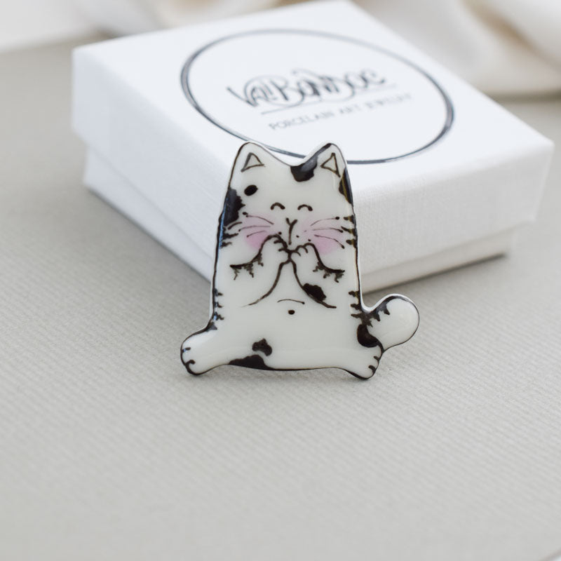 Topy cat. Porcelain brooch created and hand-painted by Vali Bondoc with high temperature ceramic dyes