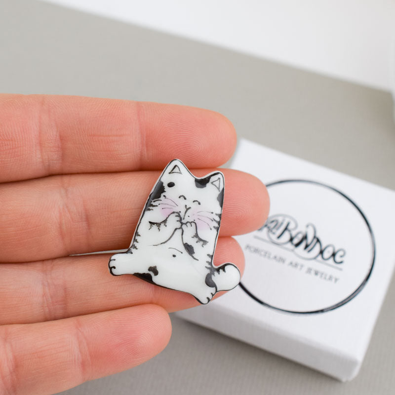 Topy cat. Porcelain brooch created and hand-painted by Vali Bondoc with high temperature ceramic dyes