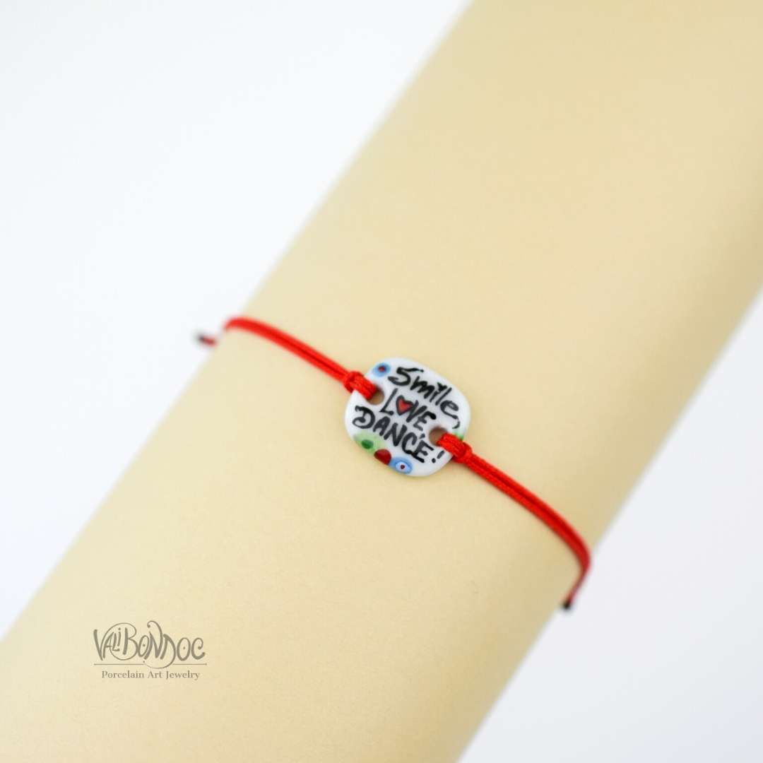 Smile-love-dance. Porcelain bracelet handmade and hand painted by Vali Bondoc