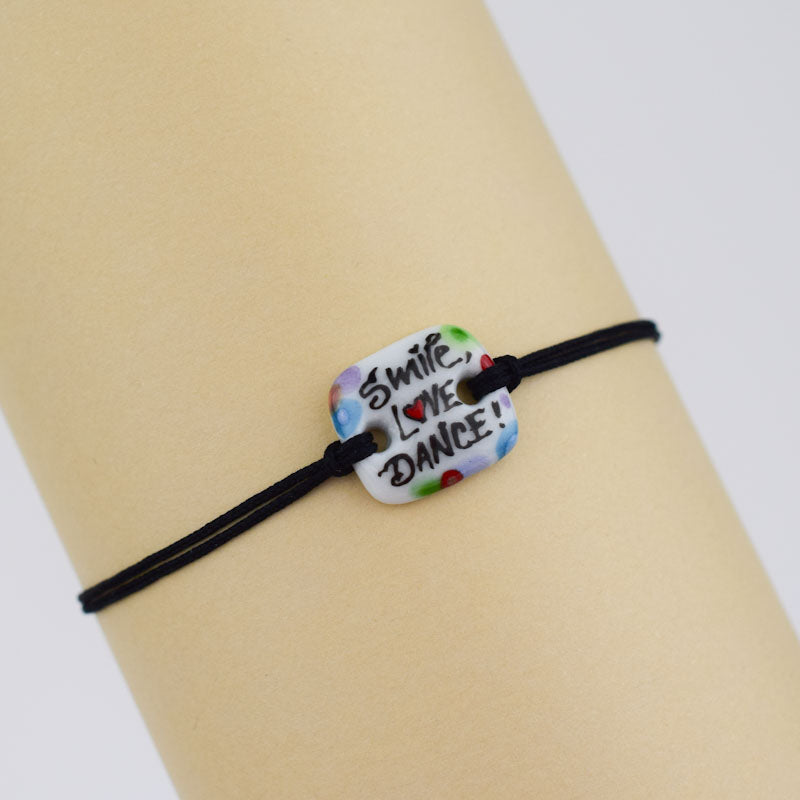 Smile-love-dance. Porcelain bracelet handmade and hand painted by Vali Bondoc
