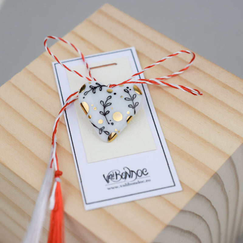 Porcelain brooch created and hand-painted by Vali Bondoc with high temperature ceramic dyes and gold