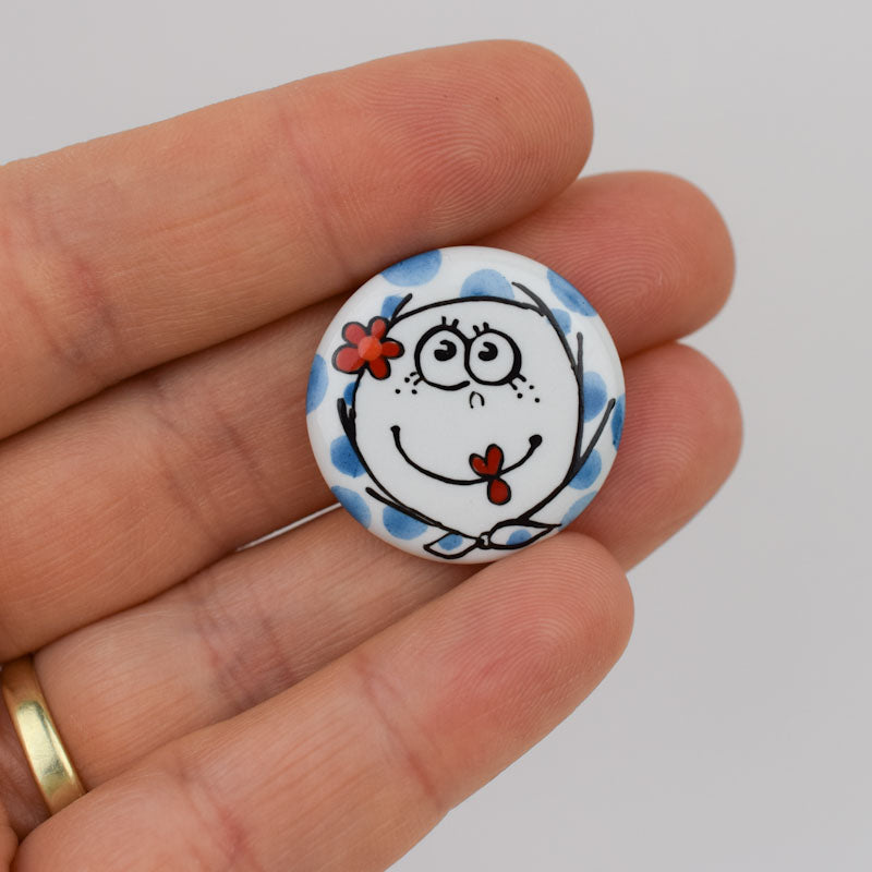 Porcelain brooch created and hand-painted by Vali Bondoc with high temperature ceramic dyes and colloidal gold.