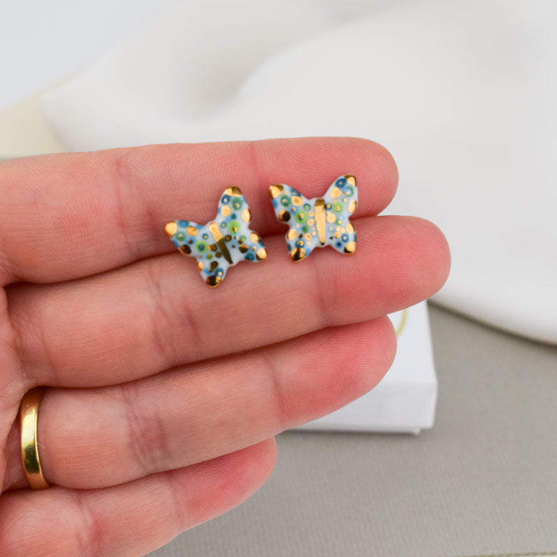 Porcelain stud earrings created and hand-painted by Vali Bondoc with high temperature ceramic dyes and colloidal gold