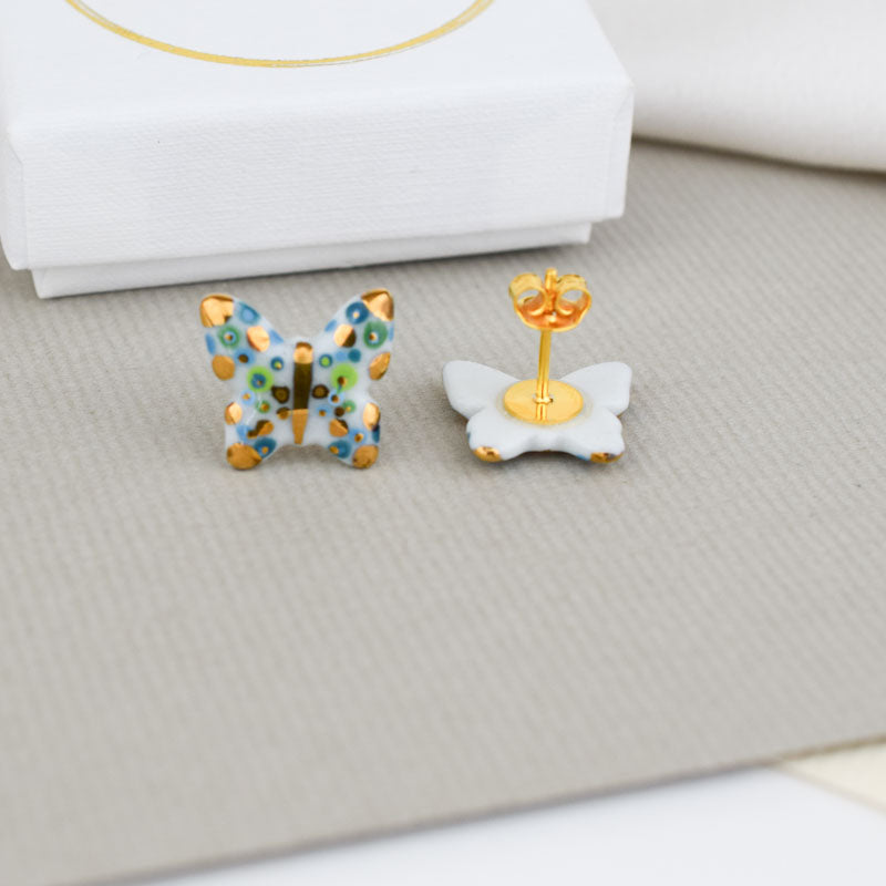Porcelain stud earrings created and hand-painted by Vali Bondoc with high temperature ceramic dyes and colloidal gold