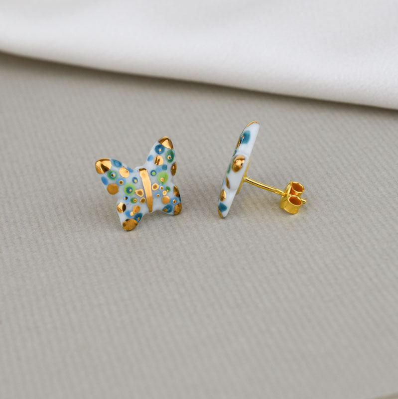 Porcelain stud earrings created and hand-painted by Vali Bondoc with high temperature ceramic dyes and colloidal gold