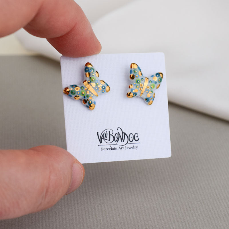 Porcelain stud earrings created and hand-painted by Vali Bondoc with high temperature ceramic dyes and colloidal gold
