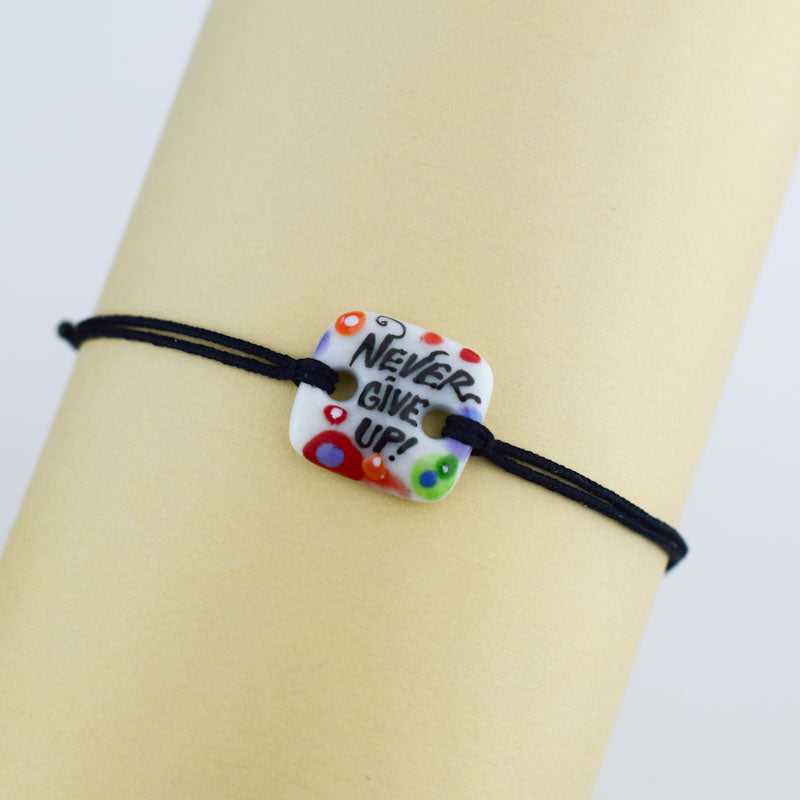 Never give up. Porcelain bracelet handmade and hand painted by Vali Bondoc