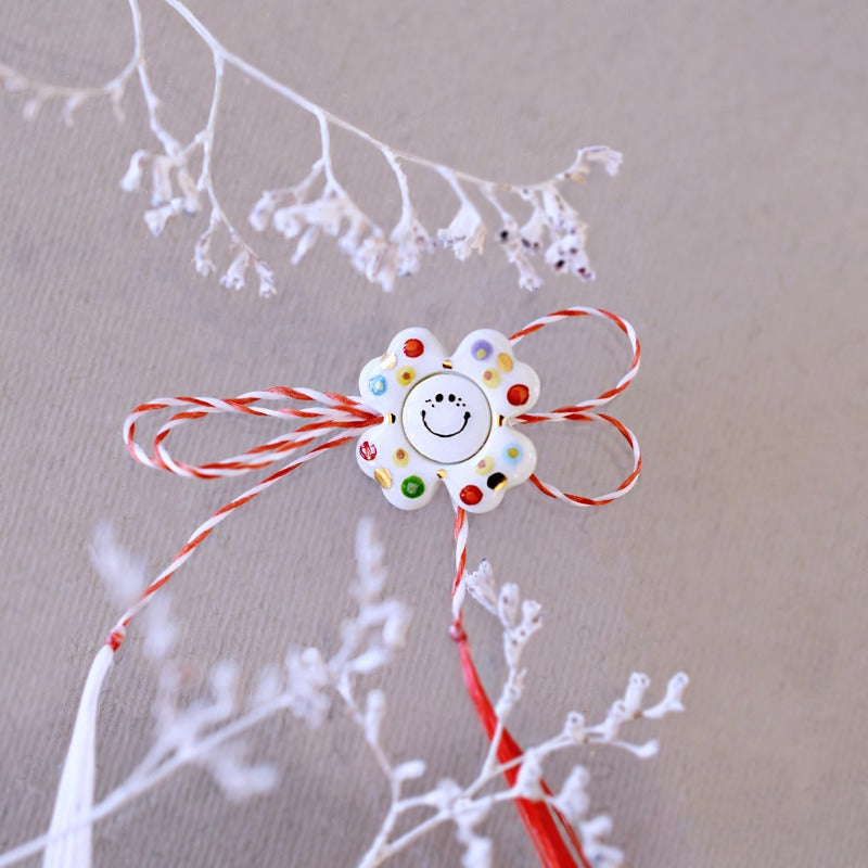 Happy flower. Little porcelain brooch modeled and painted by Vali Bondoc