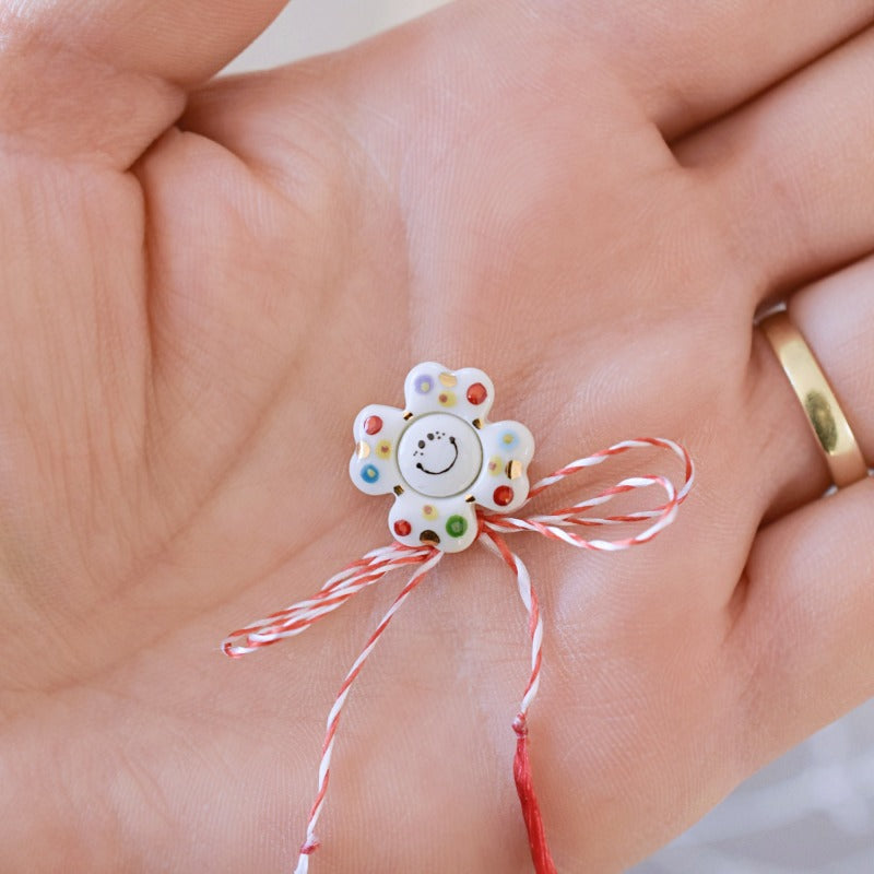 Happy flower. Little porcelain brooch modeled and painted by Vali Bondoc