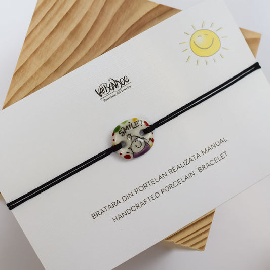 Smile. Porcelain bracelet handmade and hand painted by Vali Bondoc