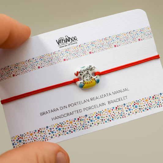 Smile. Porcelain bracelet handmade and hand painted by Vali Bondoc