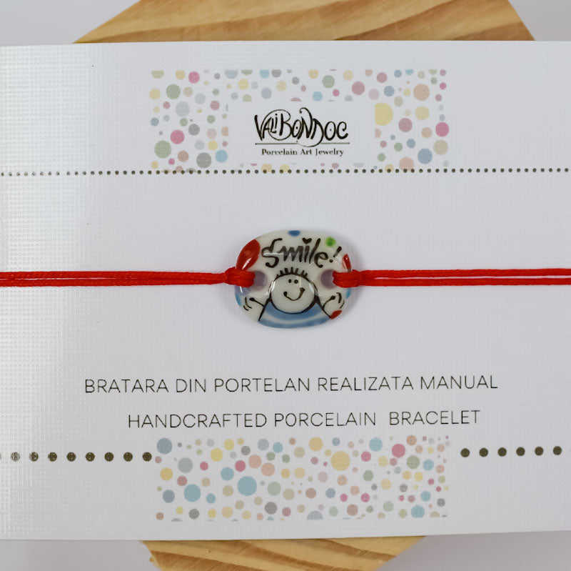 Smile. Porcelain bracelet handmade and hand painted by Vali Bondoc