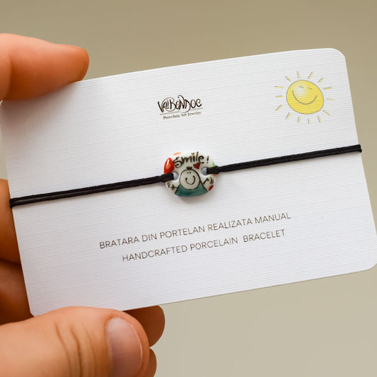 Smile. Porcelain bracelet handmade and hand painted by Vali Bondoc