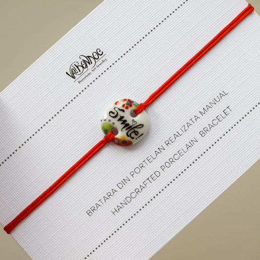 Smile. Porcelain bracelet handmade and hand painted by Vali Bondoc