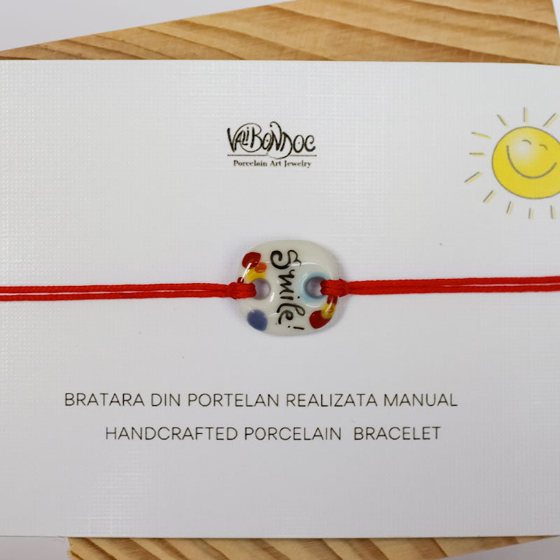 Smile. Porcelain bracelet handmade and hand painted by Vali Bondoc