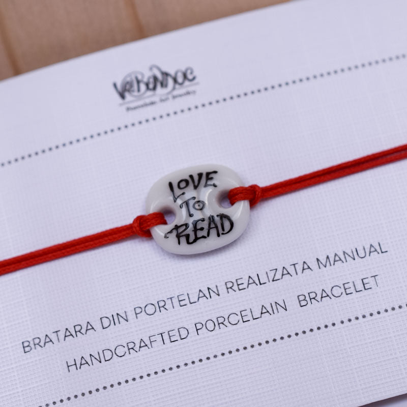 Love to read Porcelain bracelet handmade and hand painted by Vali Bondoc. Bratara din portelan modelata si pictata manual de Vali Bondoc