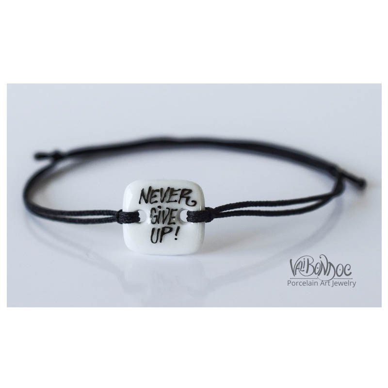 Never give up. Porcelain bracelet handmade and hand painted by Vali Bondoc