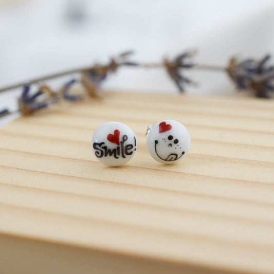 Porcelain stud earrings created and hand-painted by Vali Bondoc with high temperature ceramic dyes