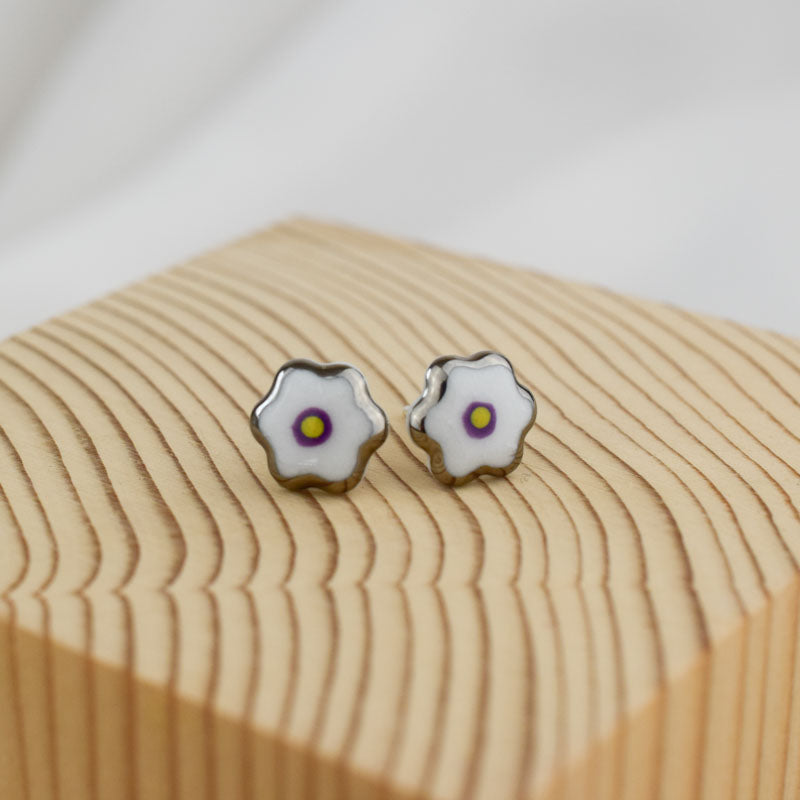 Porcelain stud earrings created and hand-painted by Vali Bondoc with high temperature ceramic dyes and platinum