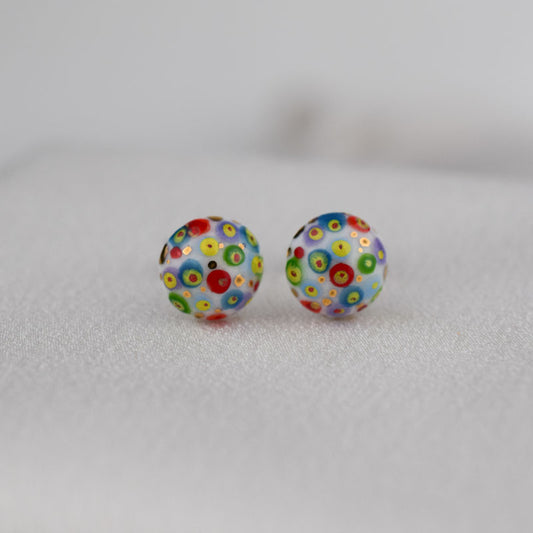 Porcelain stud earrings created and hand-painted by Vali Bondoc with high temperature ceramic dyes and colloidal gold