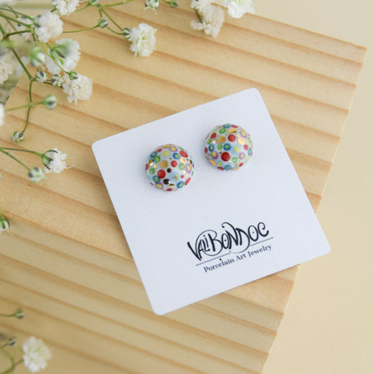 Porcelain stud earrings created and hand-painted by Vali Bondoc with high temperature ceramic dyes and colloidal gold