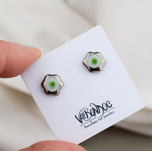 Porcelain stud earrings created and hand-painted by Vali Bondoc with high temperature ceramic dyes and colloidal gold