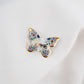 Butterfly -Smile. Porcelain brooch created and hand-painted by Vali Bondoc with high temperature ceramic dyes and colloidal gold.