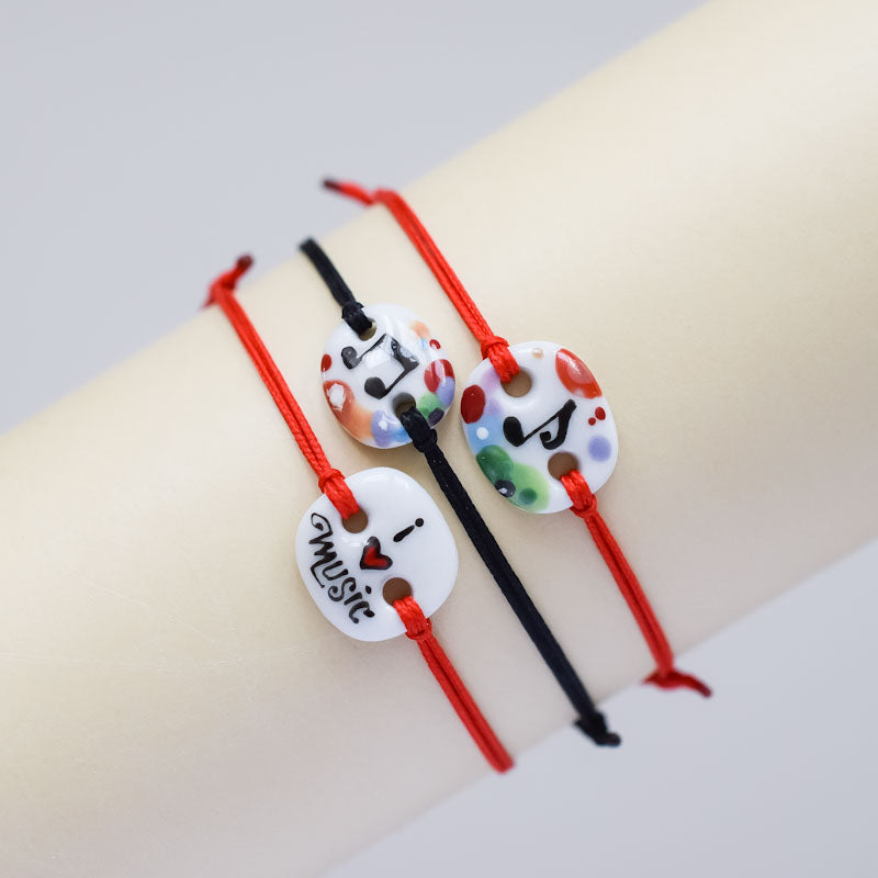 Musical note. Porcelain bracelet handmade and hand painted by Vali Bondoc