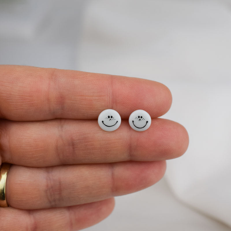 Porcelain stud earrings created and hand-painted by Vali Bondoc with high temperature ceramic dyes 
