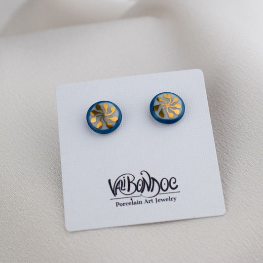 Porcelain stud earrings created and hand-painted by Vali Bondoc with high temperature ceramic dyes and colloidal gold