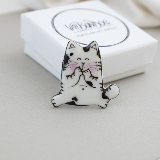 Topy cat. Porcelain brooch created and hand-painted by Vali Bondoc with high temperature ceramic dyes