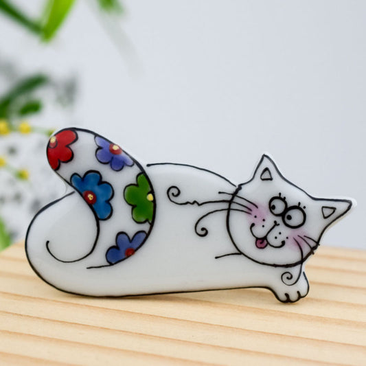 Cat. Porcelain brooch created and hand-painted by Vali Bondoc with high temperature ceramic dyes and colloidal gold.