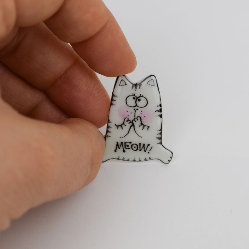 Topy cat. Porcelain brooch created and hand-painted by Vali Bondoc with high temperature ceramic dyes and colloidal gold.